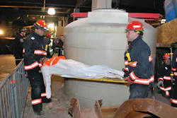 Yonkers firefighters evacuate a 'casualty' from the drill site. Yonkers firefighters evacuate a 'casualty' from the drill site.
