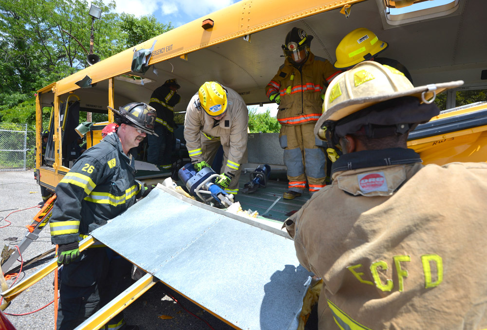 Students in Ron Moore's school bus extrication class used a variety of tools to perform basic and advanced extrication skills on a school bus at Firehouse Expo Tuesday.