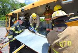 Students in Ron Moore's school bus extrication class used a variety of tools to perform basic and advanced extrication skills on a school bus at Firehouse Expo Tuesday. Students in Ron Moore's school bus extrication class used a variety of tools to perform basic and advanced extrication skills on a school bus at Firehouse Expo Tuesday.