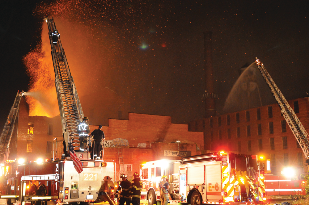 A three-alarm fire ripped through an old Seagram's factory building in Baltimore County, MD, on July 27, 2013.