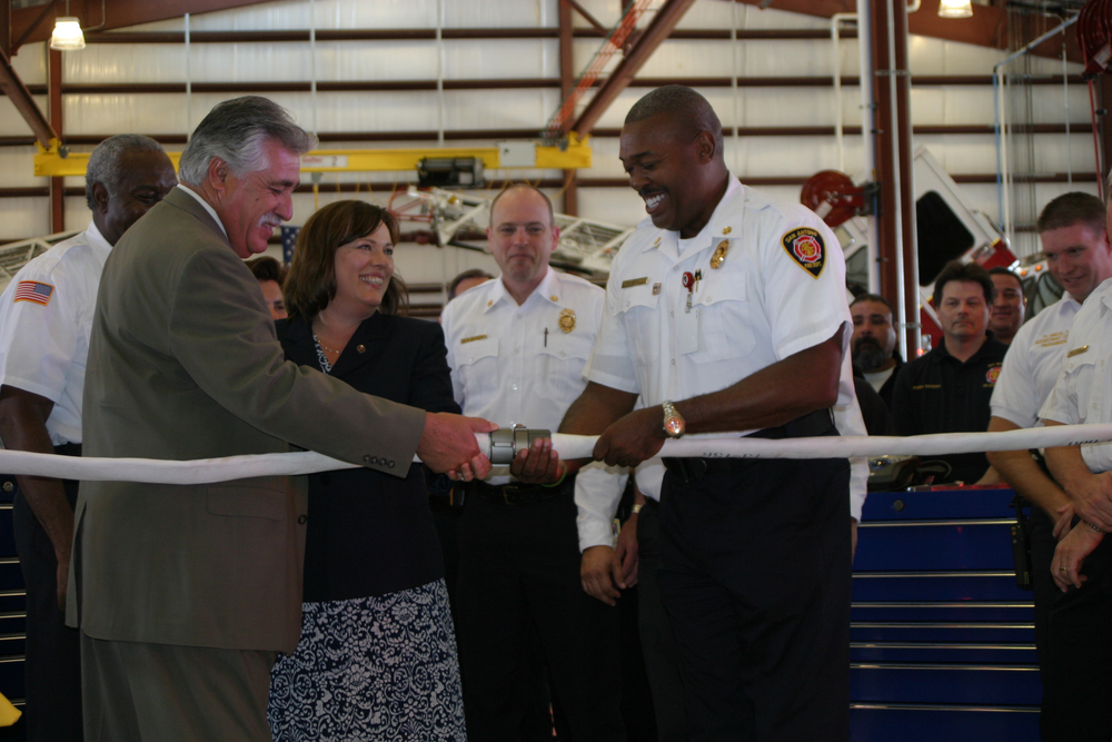 San Antonio District 6 City Councilman Ray Lopez (left), City Architect Carol Warkoczewski and SAFD Chief Charles Hood took part in the 'uncoupling' ceremony.