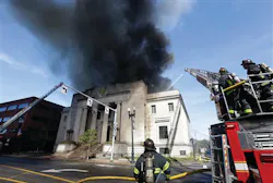 Firefighters spray water on a burning building Monday, Sept. 30, 2013, in Quincy, Mass. The historic building was built in 1926 as a Masonic Temple. Firefighters spray water on a burning building Monday, Sept. 30, 2013, in Quincy, Mass. The historic building was built in 1926 as a Masonic Temple.