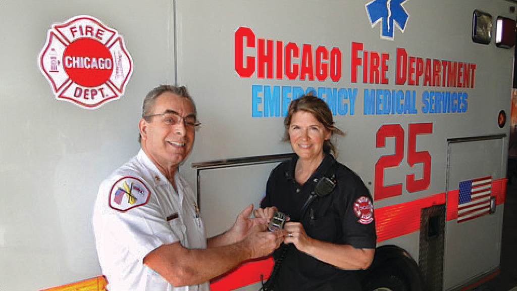 Chicago Fire Department Deputy District Chief Robert Anthony presents Paramedic Anne Gradolf with a dedicated meter for detecting carbon monoxide (CO) gas. Last year, Gradolf's 'gut instincts' saved the lives of 10 people suffering from CO poisoning in a home in city's southeast side.