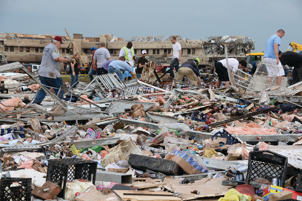 Emergency responders and civilians quickly came face to face with the total destruction created by the Moore tornado.