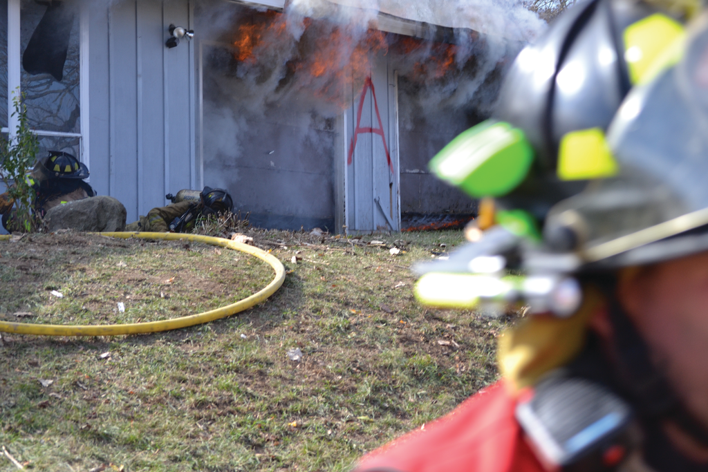 Firefighter Candace Wetter, right, and the nozzleman after they bailed out of the burn building.