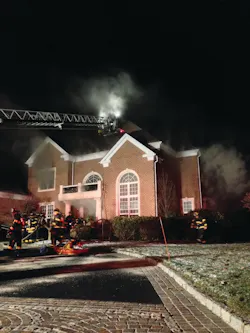 A deputy chief arrived on the scene initially with light smoke visible. This photo shows the house prior to it becoming heavily involved in fire. At this incident, officers and members operating on the scene saw warning signs and took immediate measures to get their members out in time. A deputy chief arrived on the scene initially with light smoke visible. This photo shows the house prior to it becoming heavily involved in fire. At this incident, officers and members operating on the scene saw warning signs and took immediate measures to get their members out in time.