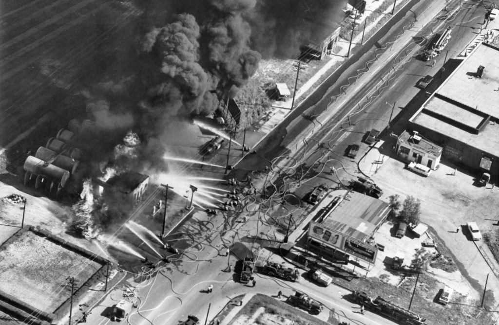 Six firefighters were killed fighting a gasoline fire shortly after this photo was taken on the border between Kansas City, KS, and Kansas City, MO.