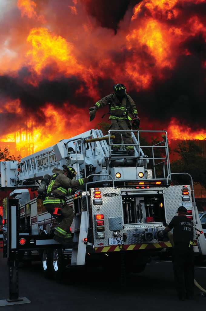 Houston Fire Department Tower 6 crew prepares to operate a master stream on the A (west) side.