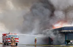 Crews operate defensively on the Alpha side of the furniture store with a monitor from Roseburg Engine 1332. Crews operate defensively on the Alpha side of the furniture store with a monitor from Roseburg Engine 1332.