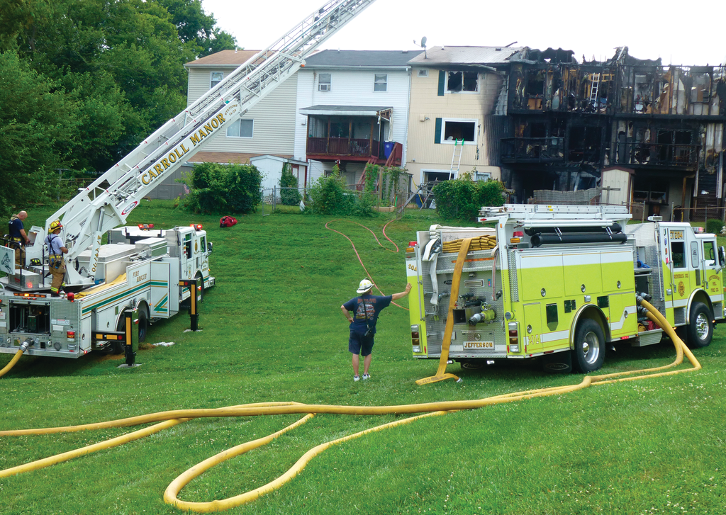 This fire recently ripped through five townhomes in Brunswick, Md. Here, apparatus had to drive over several hundred feet of grass to access the rear of the structures.
