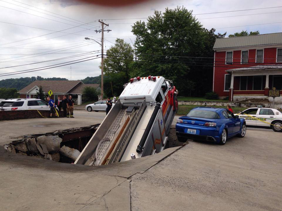 The funeral home parking lot gave way.