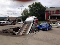 The funeral home parking lot gave way. The funeral home parking lot gave way.