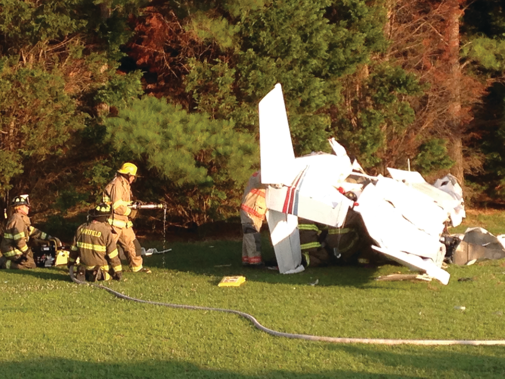 Crews from the Hartfield Volunteer Fire Department perform extrication of the second patient, who was deceased as a result of the crash.