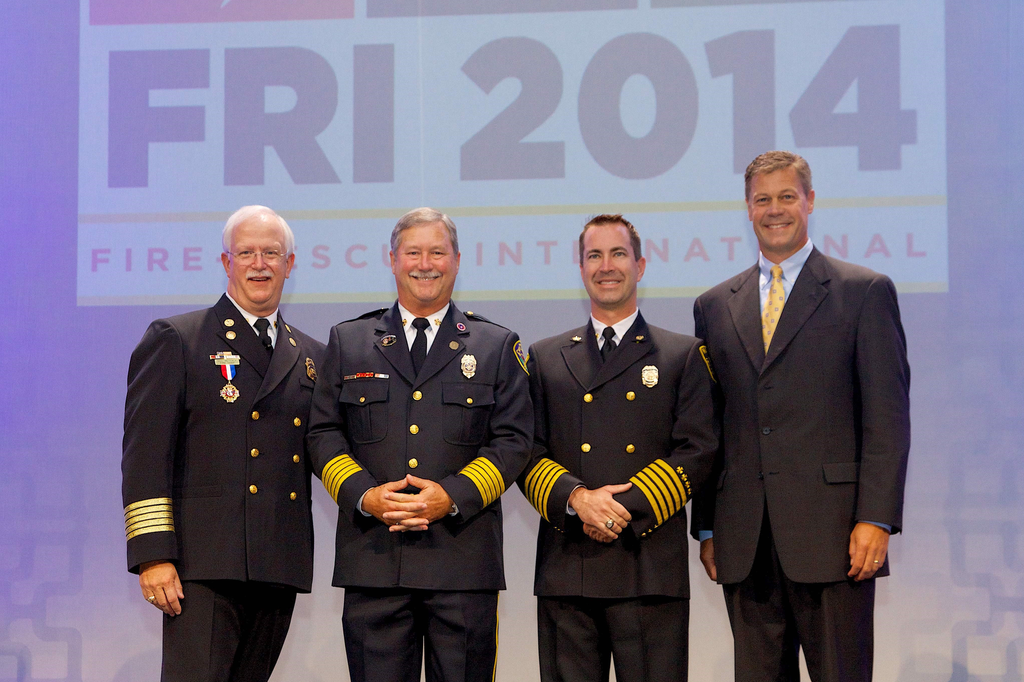 Pictured from left to right: Fire Chief Bill Metcalf (IAFC President), 2014 Career Fire Chief Honoree Alan J. Martin, 2014 Volunteer Fire Chief Honoree Chris Barron, and Jim Johnson, Oshkosh Corporation executive vice president and president, Fire & Emergency.