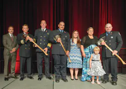 The Firehouse® Magazine Heroism Awards program honored members of the Bryan, TX, Fire Department during the Opening Ceremonies at Firehouse Expo 2014 in Baltimore, MD, in July. From left to right: Bryan City Manager Kean Register; Assistant Chief Terry Barnett; Fire Chief Randy McGregor; Firefighter Mitchel Moran and his fiancee, Katy Garcia; Kara Mantey and Kanzie Mantey, wife and daughter of Firefighter Ricky Mantey; and Mantey. Lieutenant Greg Pickard was honored posthumously. The Firehouse® Magazine Heroism Awards program honored members of the Bryan, TX, Fire Department during the Opening Ceremonies at Firehouse Expo 2014 in Baltimore, MD, in July. From left to right: Bryan City Manager Kean Register; Assistant Chief Terry Barnett; Fire Chief Randy McGregor; Firefighter Mitchel Moran and his fiancee, Katy Garcia; Kara Mantey and Kanzie Mantey, wife and daughter of Firefighter Ricky Mantey; and Mantey. Lieutenant Greg Pickard was honored posthumously.