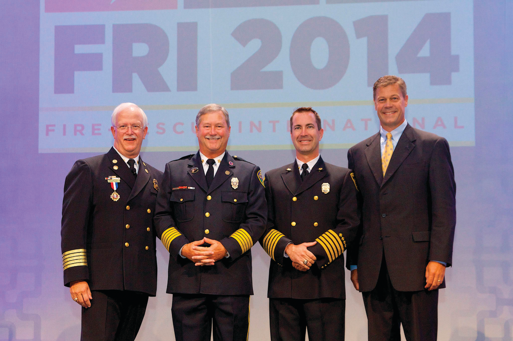 Pictured from left to right: Fire Chief Bill Metcalf (IAFC President), 2014 Career Fire Chief Honoree Alan J. Martin, 2014 Volunteer Fire Chief Honoree Chris Barron and Jim Johnson, Oshkosh Corporation executive vice president and president, Fire & Emergency.