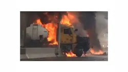 Video captured the driver of a tanker, whose head can be seen in this screengrab, escaping from his burning rig. Video captured the driver of a tanker, whose head can be seen in this screengrab, escaping from his burning rig.