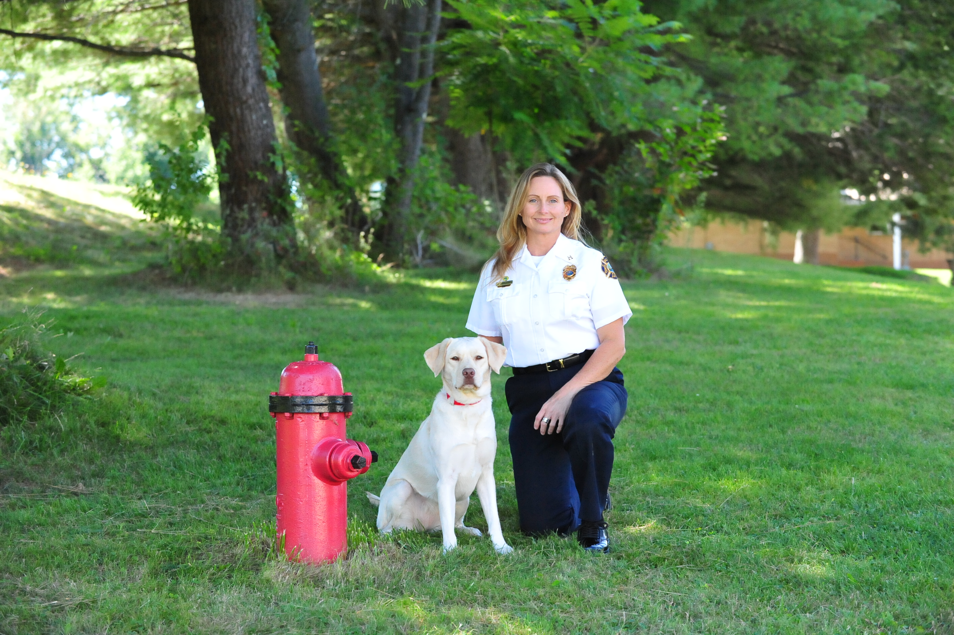 Gracie, the two-year-old yellow Lab, with Captain Roseanne Moreland.