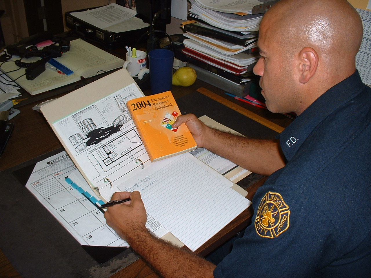 A student practices for a potential hazardous material scenario.
