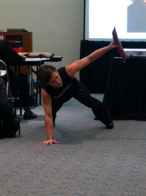 Sarah Apgar demonstrates one of the exercises designed specifically for firefighters.