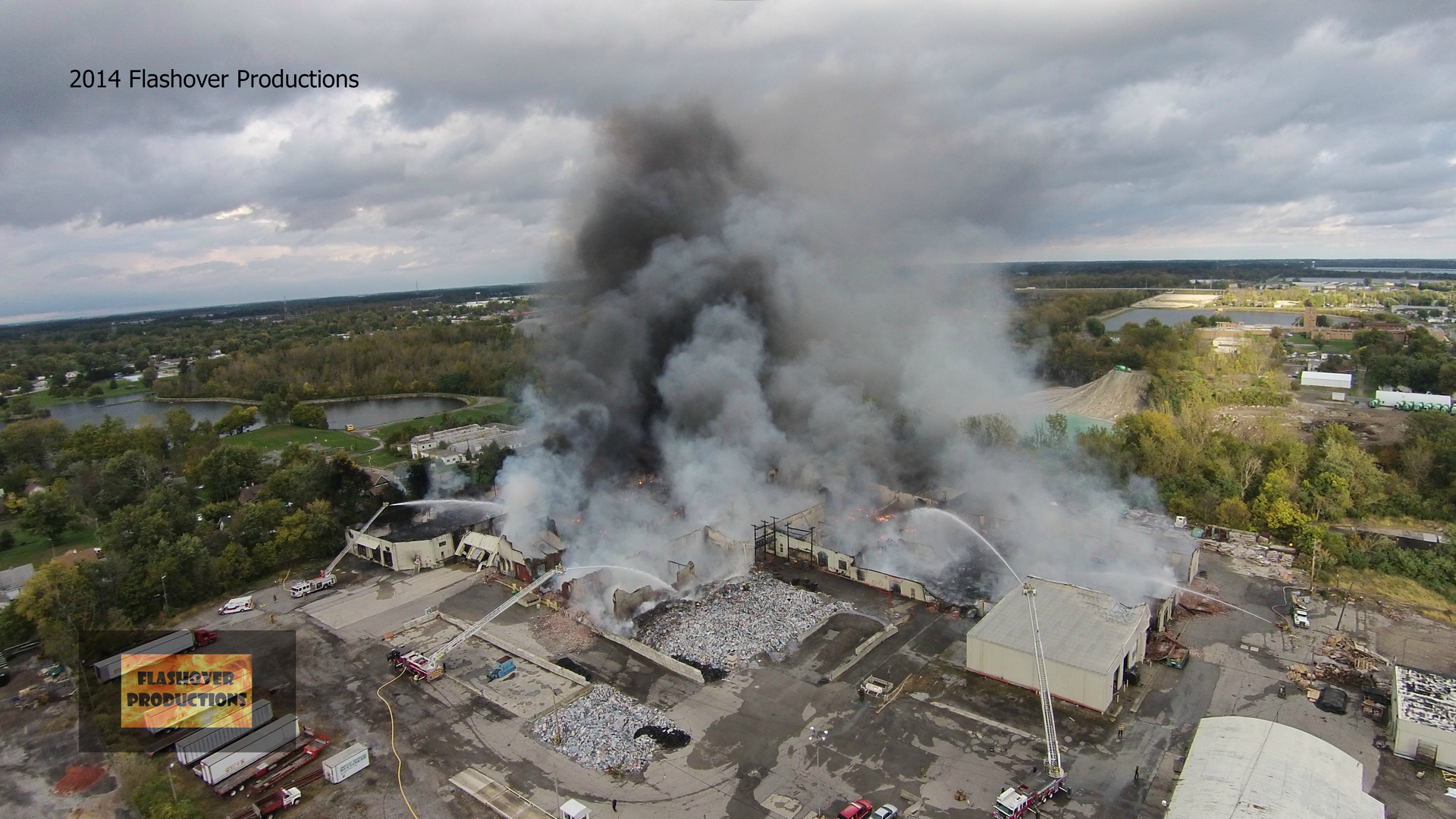 A photo taken from a drone several hours into the fire shows aerial streams in operation and large piles of vinyl scrap waiting to be processed.