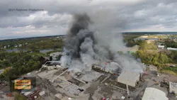 A photo taken from a drone several hours into the fire shows aerial streams in operation and large piles of vinyl scrap waiting to be processed. A photo taken from a drone several hours into the fire shows aerial streams in operation and large piles of vinyl scrap waiting to be processed.