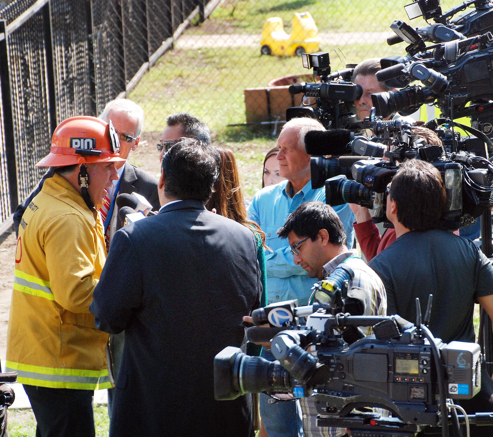 Pick one of the reporters and conduct the interview as though you are talking to them alone. If asked a question by another reporter, you can look at that reporter. Pretend the cameras are not there.