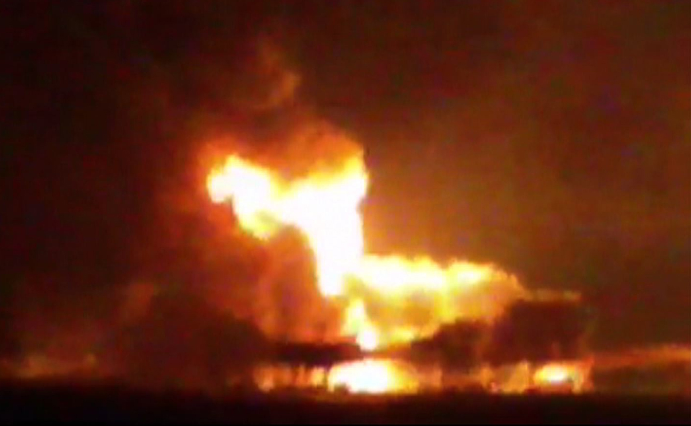 This frame grab of a video from the news station Noticias Ciudad del Carmen shows a fire burning at an oil platform in the Gulf of Mexico along the Mexican coast before sunrise on Wednesday, April 1, 2015. The fire broke out overnight at the Abkatun Permanente platform, located in the Campeche Sound, near the coast of the Mexican states of Campeche and Tabasco.