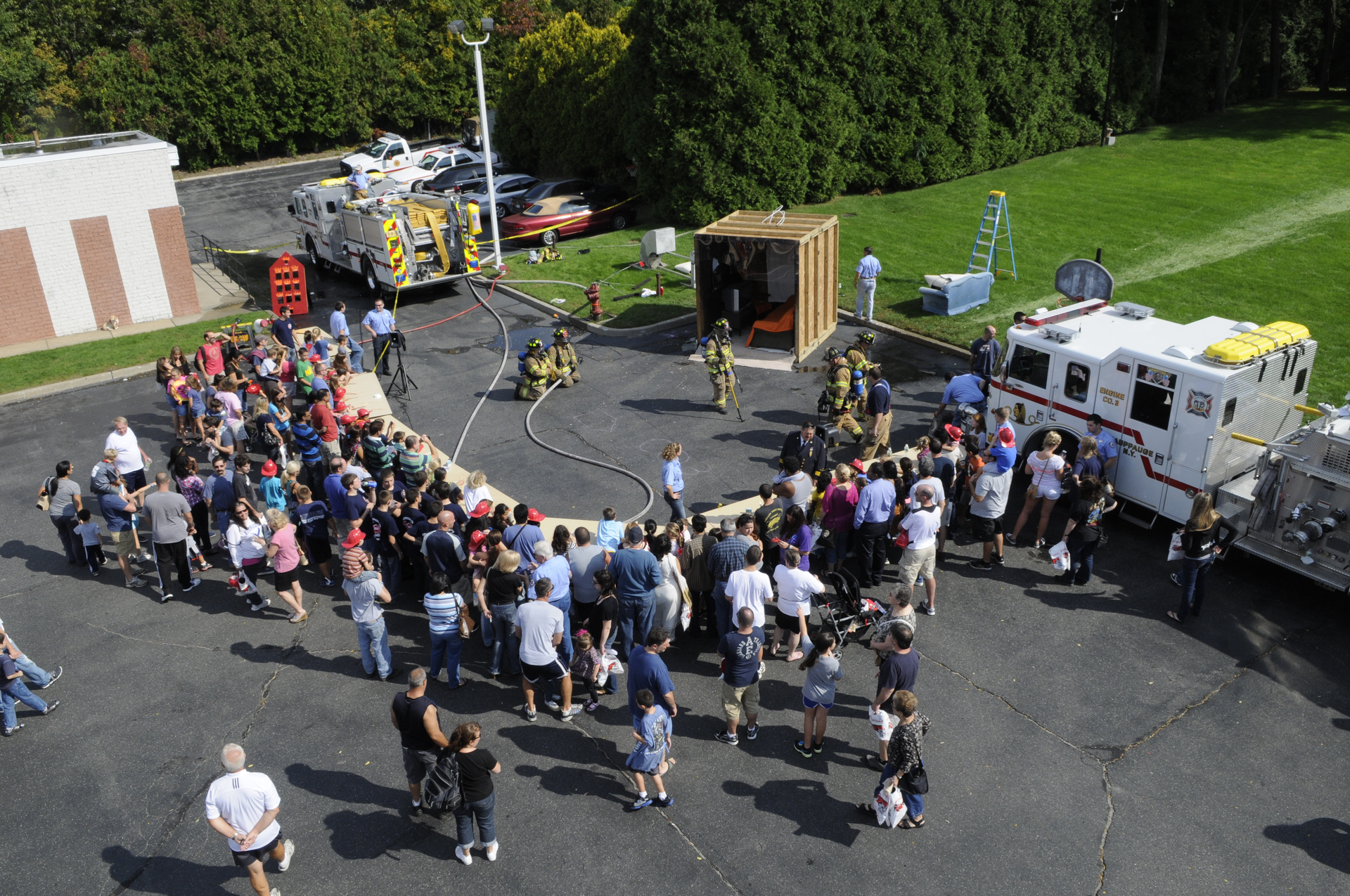 As part of the Hauppauge, NY, Fire Department&rsquo;s annual fire safety and prevent event, firefighters prepare to start a room and contents fire to demonstrate the effectiveness of home fire suppression systems.