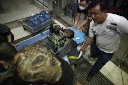 A Chinese firefighter is transported from the blast scene where a number of responders were killed or are missing. A Chinese firefighter is transported from the blast scene where a number of responders were killed or are missing.
