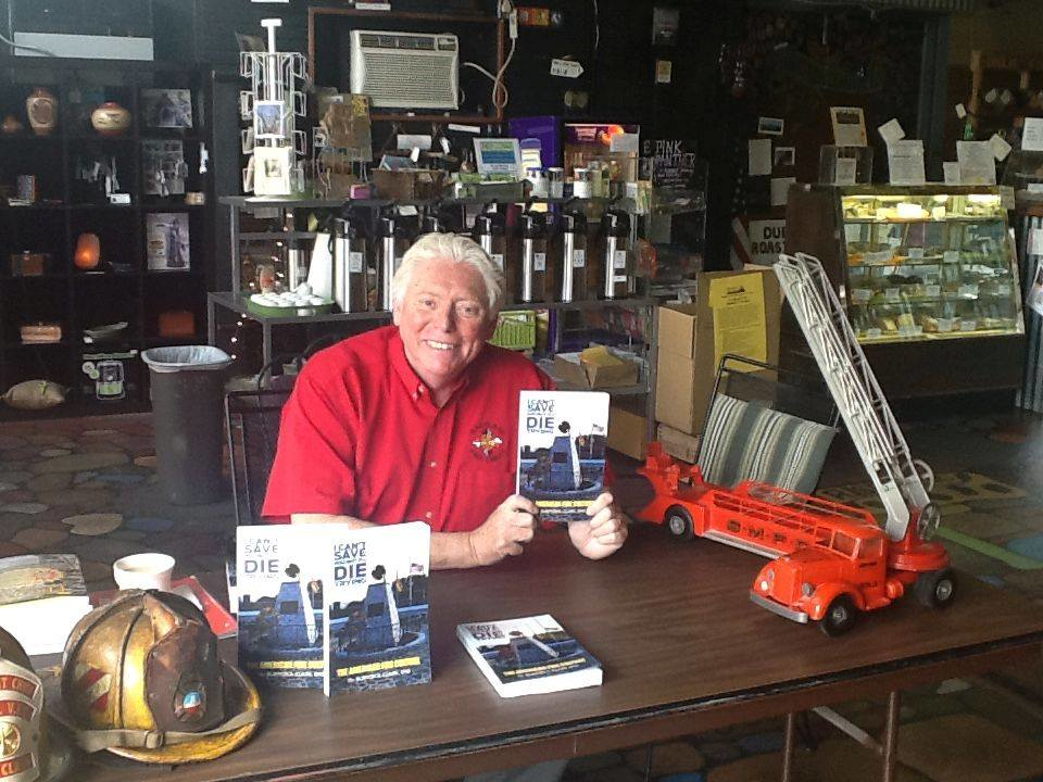 Dr. Burton Clark with his book, 'I Can't Save You, But I'll Die Trying.'