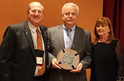Mike Wieder, IFSTA Executive Director, left is pictured with Mr. and Mrs. Kevin Roche.