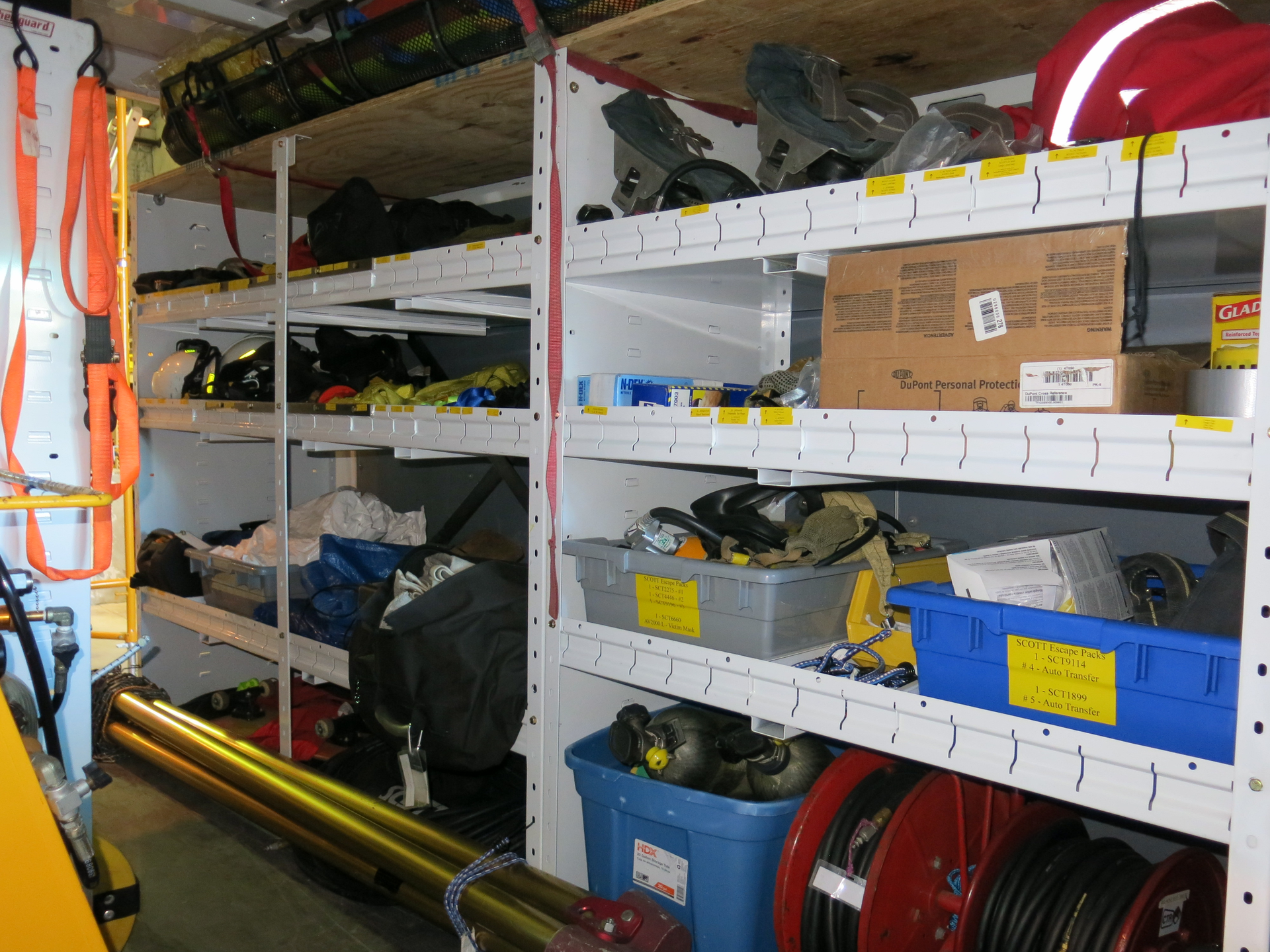 CTR uses the yellow inventory labels on all shelving and equipment to track resources. This photo was taken inside one of their training vehicles.