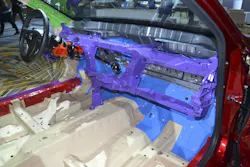 This display of a 2015 Acura TLX sedan shows the all magnesium instrument panel structure in purple. Note that there is only one tie-down leg that bolts onto the floorboard tunnel. This display of a 2015 Acura TLX sedan shows the all magnesium instrument panel structure in purple. Note that there is only one tie-down leg that bolts onto the floorboard tunnel.