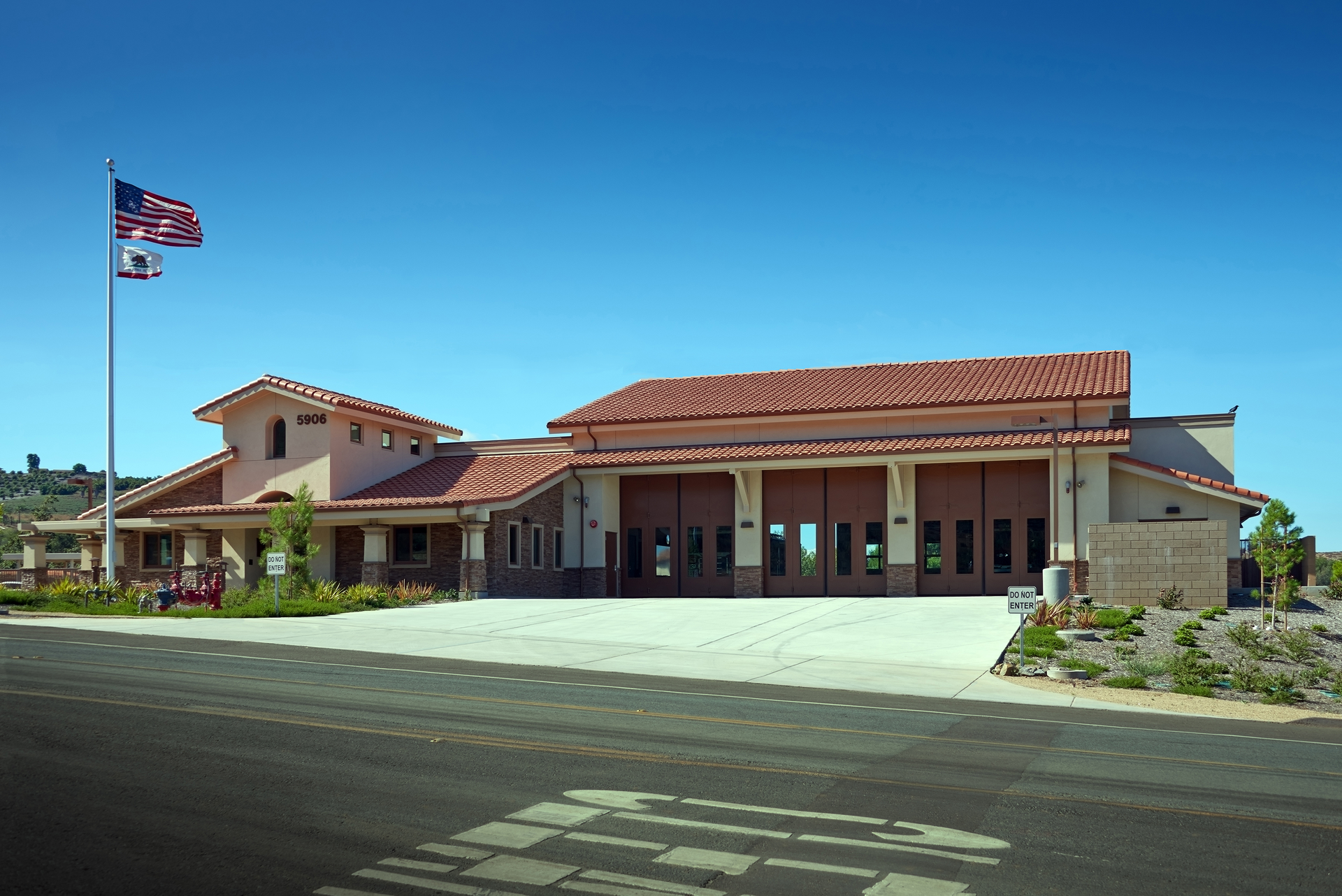 The station was designed using a combination of plaster and stone veneer similar to adjacent homes.
