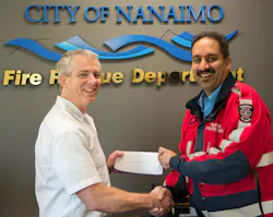 DVW franchisee Kelly Comeau in Nanaimo, British Columbia, presents an award of $500 to Fire Prevention Officer Umesh Lal of the Nanaimo Fire Rescue Department, one of six fire safety programs in the U.S. and Canada to receive a DVW grant. DVW franchisee Kelly Comeau in Nanaimo, British Columbia, presents an award of $500 to Fire Prevention Officer Umesh Lal of the Nanaimo Fire Rescue Department, one of six fire safety programs in the U.S. and Canada to receive a DVW grant.
