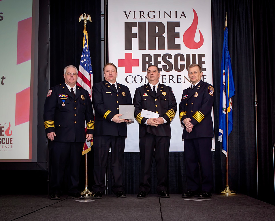 (Left to right): Chief David Layman, President of VFCA and City of Hampton; Scott Quintana, captain, Shift Safety Officer, Alexandria Fire Dept.; Fire Chief Robert Dube and Chief William 'Pat' Dent, First Vice President of VFCA and City of Williamsburg.