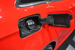 Opening one small door on the side of this vehicle reveals that it is the fuel filler port door. At least at this point you know this vehicle has a fuel tank for its gasoline or diesel engine. It could, however, be a hybrid. You must continue with your walk-around to find out what you are dealing with. Opening one small door on the side of this vehicle reveals that it is the fuel filler port door. At least at this point you know this vehicle has a fuel tank for its gasoline or diesel engine. It could, however, be a hybrid. You must continue with your walk-around to find out what you are dealing with.