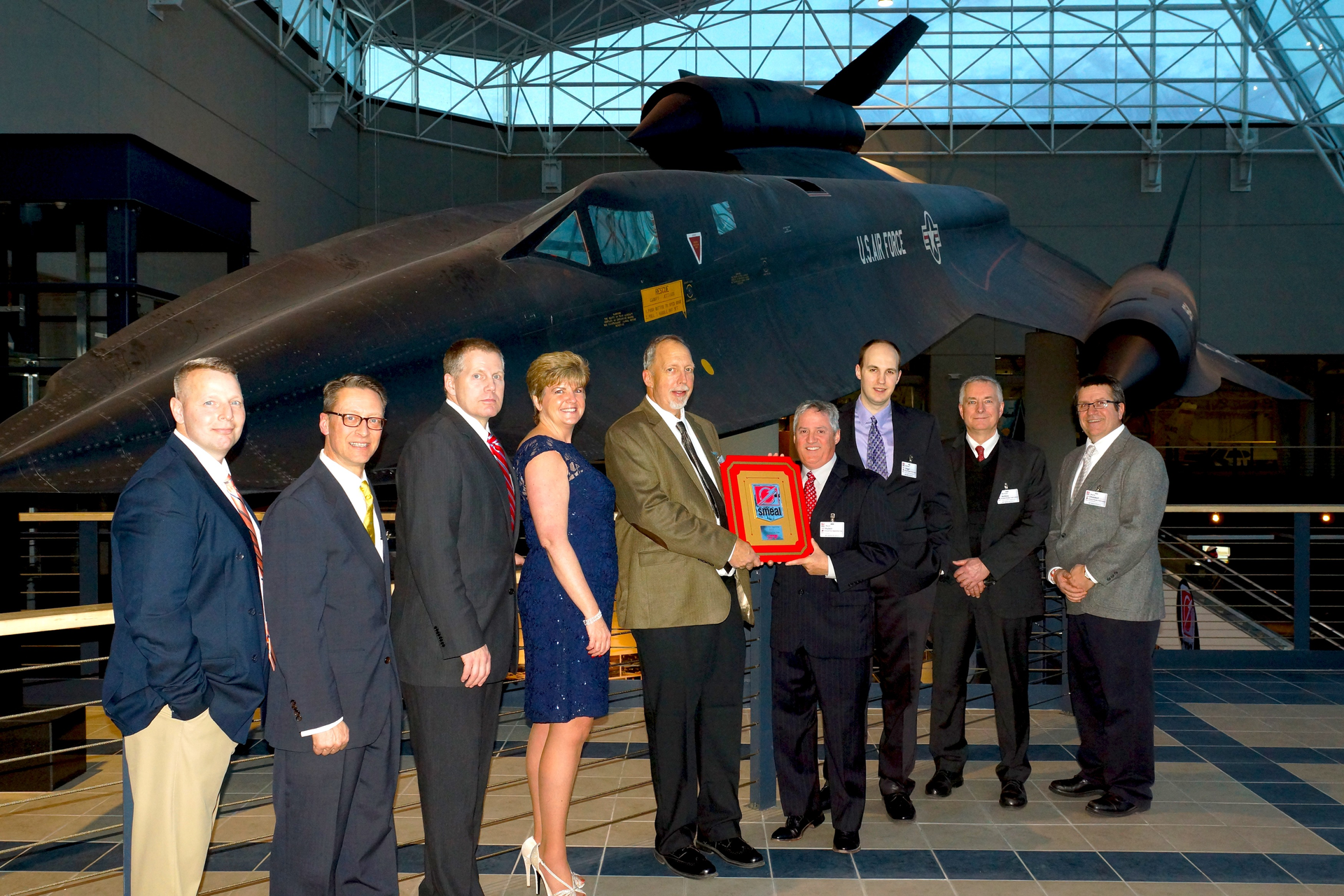 Daniel Rossetti, Sales Rep., UPF; Paul Pieragostini, Director of Procurement and Supply Chain, Smeal; Patrick Cahill, Director of Sales, UPF; Kathleen Finneral, Customer Service Supervisor, UPF; Joseph Lingel, President & CEO, UPF; Mark Huber, President, Smeal; Andrew Lingel, VP of Operations, UPF; Michael Ashley, Vice President of Engineering, UPF; Marty Etteldorf, Plant Manager, UPF.