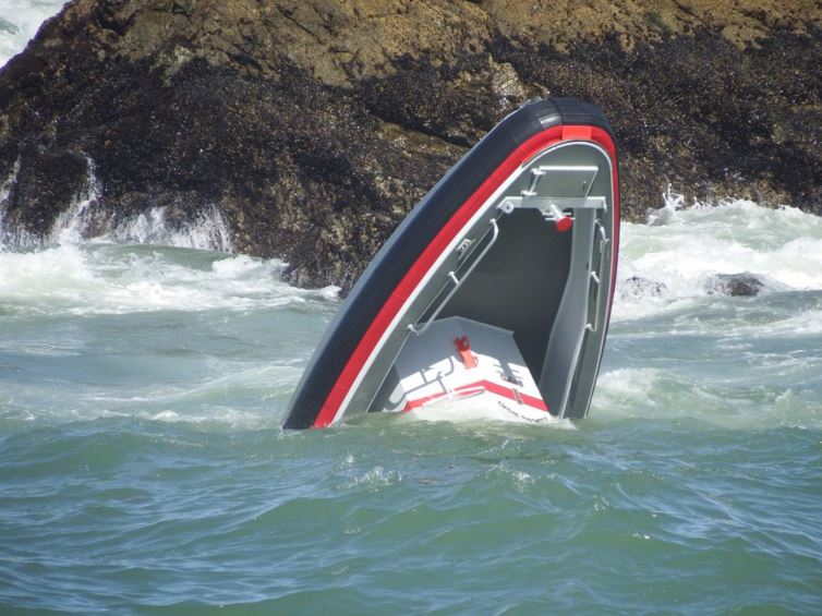 Only the bow of the San Francisco fire boat is visible after it capsized.
