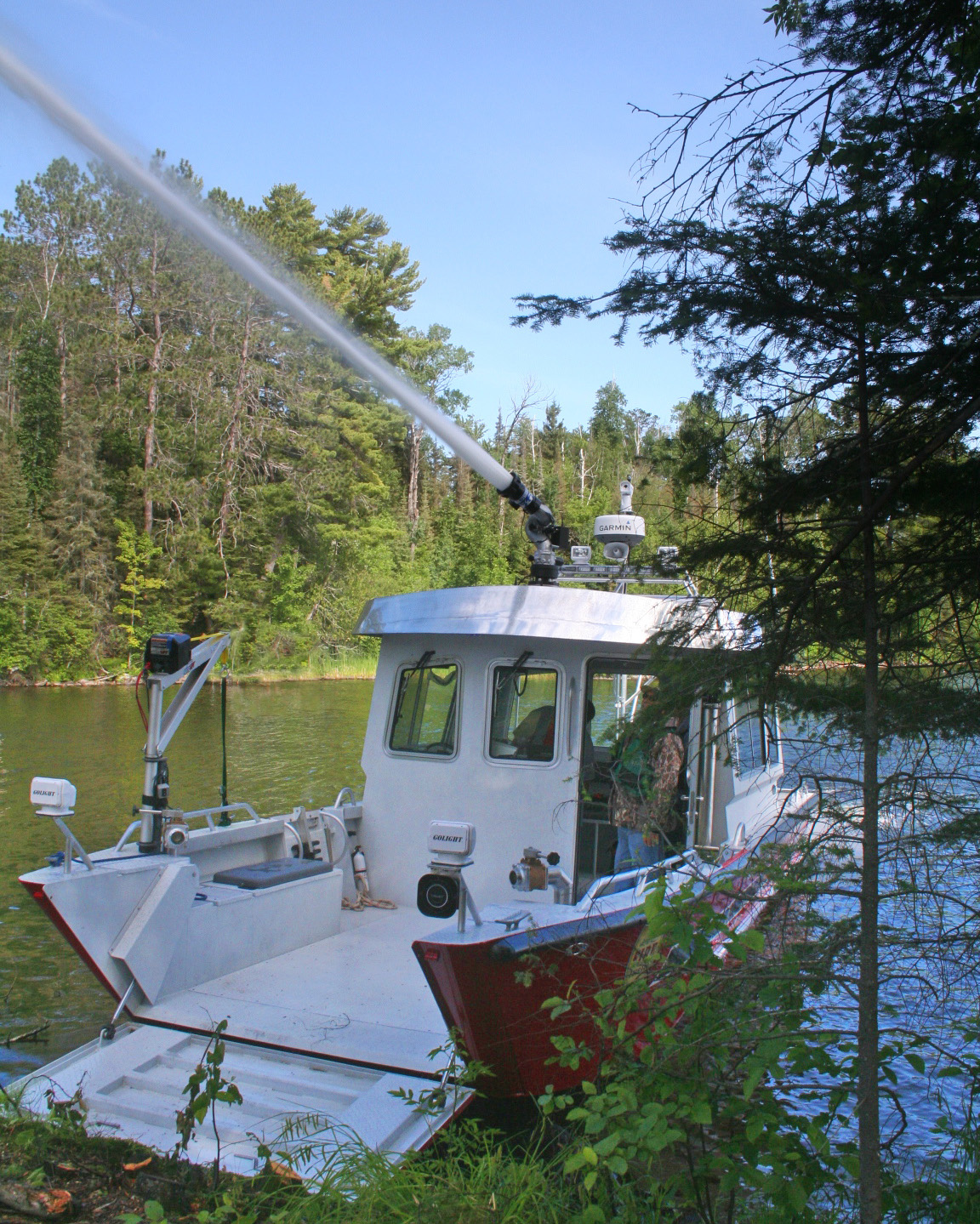 A 33-foot Lake Assault fireboat, owned and operated by the Lake Vermilion Fire Brigade, provided support for wildland firefighting efforts during the Foss Lake wildfire near Ely, Minn. earlier this spring. The 33-foot craft was used to haul up to 20-person crews, and their canoes and equipment to staging areas to fight the blaze.