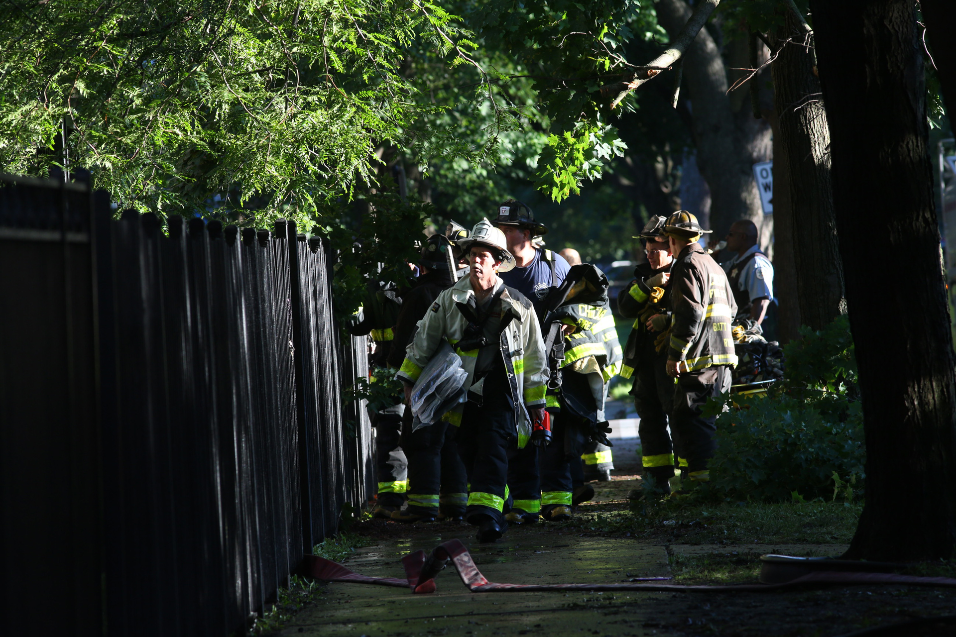 Firefighters wrap up after a devastating fire.