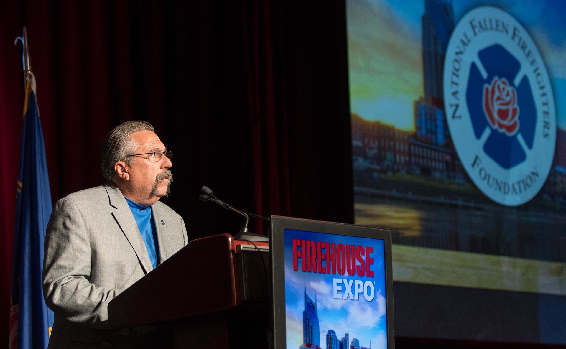 NFFF Executive Director Ron Siarnicki prepares to present the Arthur J. Glatfelter Distinguished Service Award.