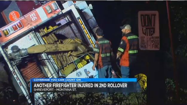 Workers survey Shreveport Engine 6 after it rolled over Tuesday night.