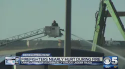 Phoenix firefighters were operating in an aerial ladder bucket when it was struck by a crane. Phoenix firefighters were operating in an aerial ladder bucket when it was struck by a crane.
