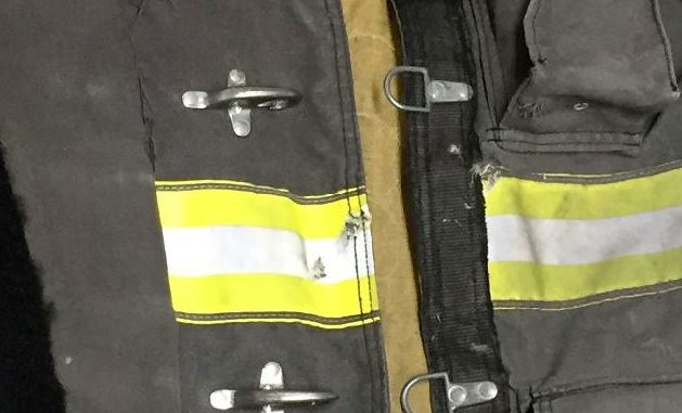 Firefighter Dwayne Montgomery's PPE was hit by a bullet, but he was uninjured.