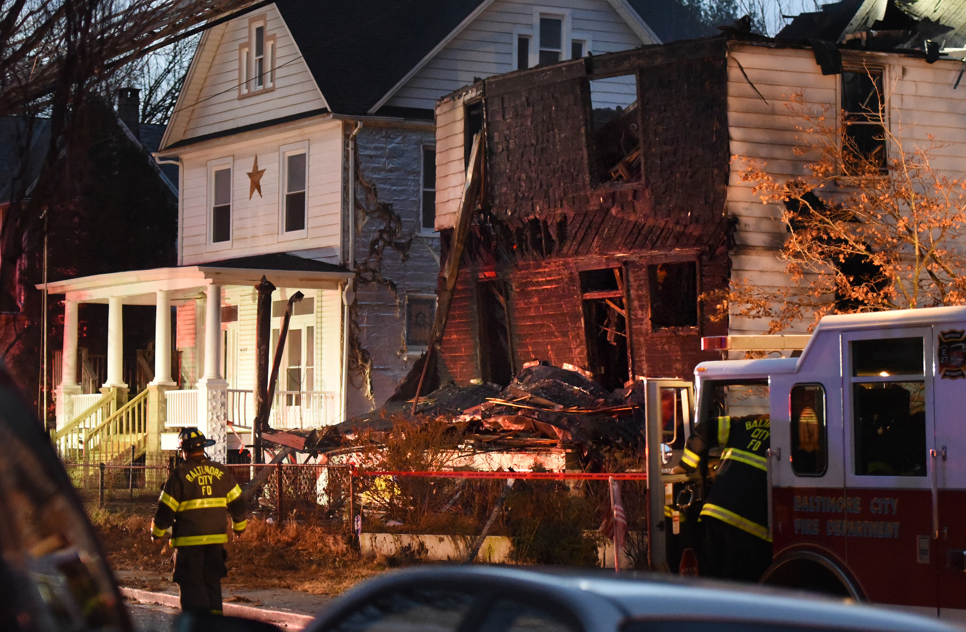 Baltimore City firefighters at the scene after a deadly fire on Springwood Avenue in northeast Baltimore.