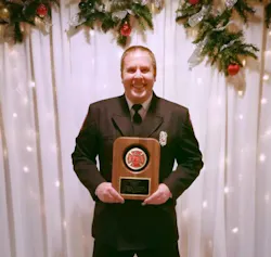 Firefighter/Paramedic Justin Root proudly displays his 2016 Rookie of the Year Award. Firefighter/Paramedic Justin Root proudly displays his 2016 Rookie of the Year Award.