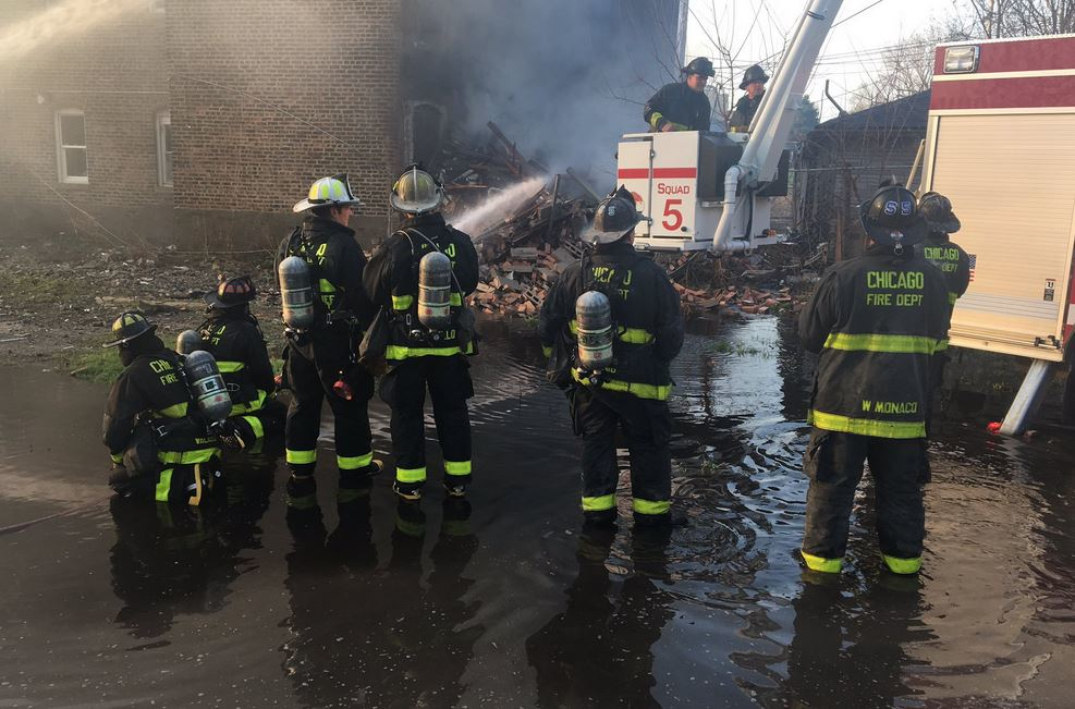 Thirty-two members of the Chicago Fire Department's brass resigned their positions and returned to the rank-and-file amid an ongoing pay and benefit dispute.