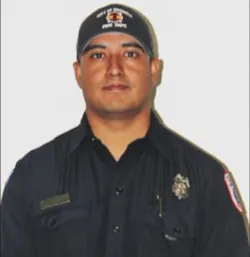 Roswell firefighter Carlos Garcia was off-duty when he helped rescue two men trapped in a burning truck. Roswell firefighter Carlos Garcia was off-duty when he helped rescue two men trapped in a burning truck.